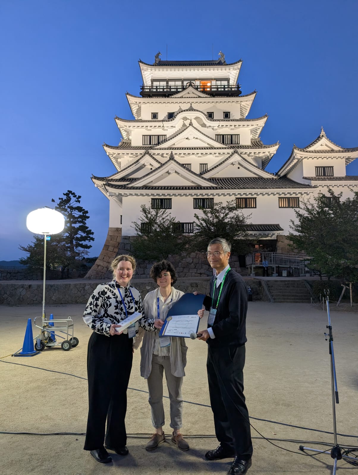 Karin and Didem receiving the
                                certificate of recognition