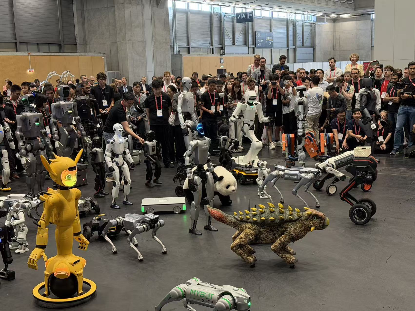 A large and diverse group of robots gathered for a photo at ICRA 2026