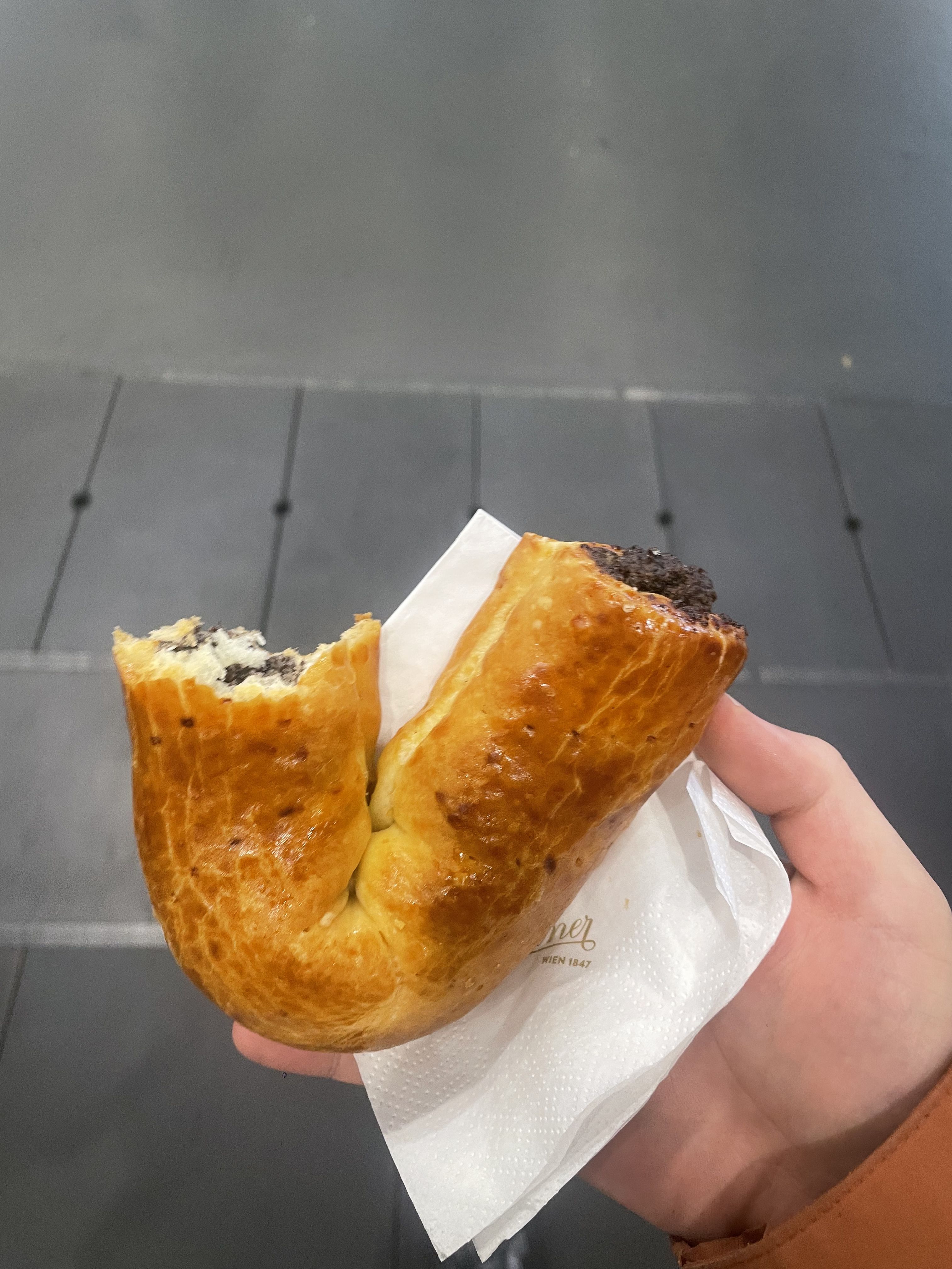 A Viennese pastry held in one hand